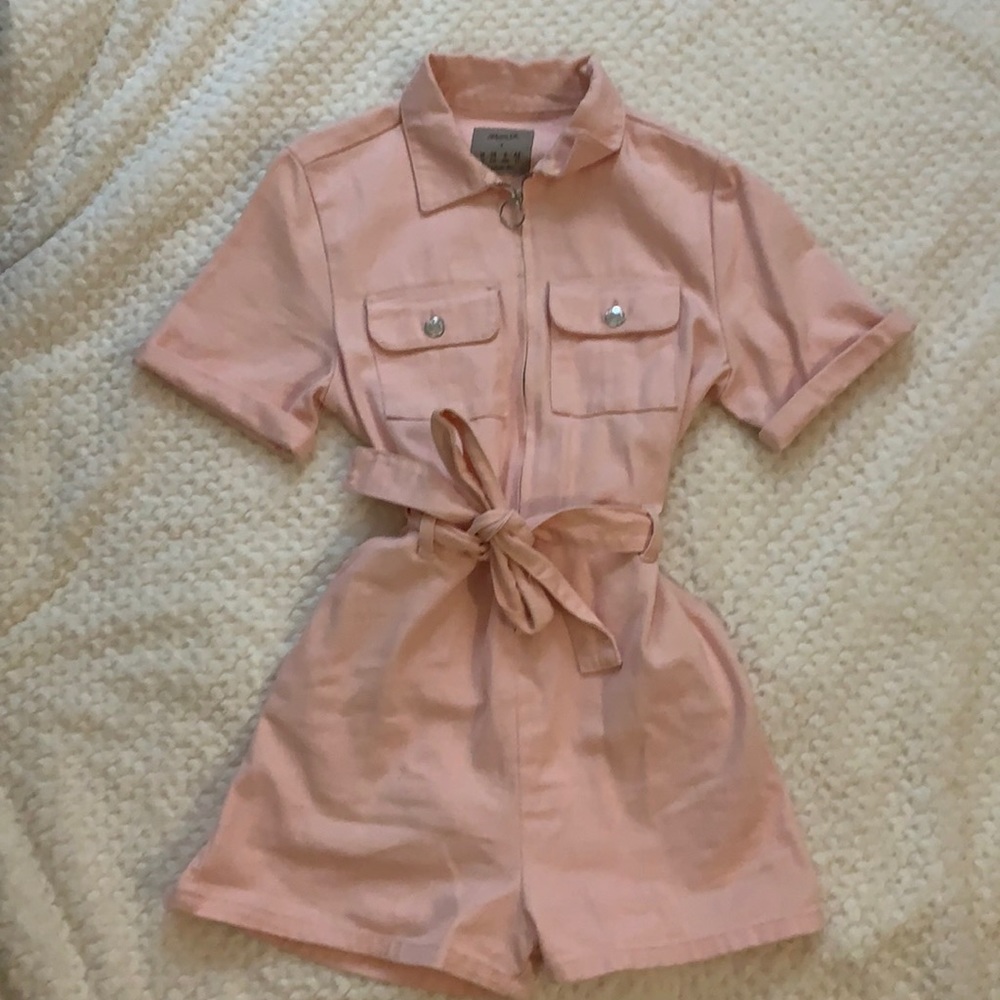 Pink Utility Jumpsuit with shorts, zipper front, tie waist, and pockets